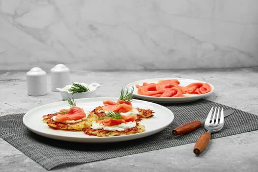 Crispy potato pancakes with salmon and soft cheese
