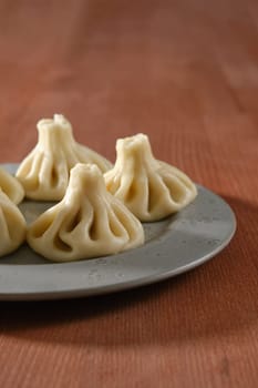 Close-up view of Georgian boiled dumplings - khinkali