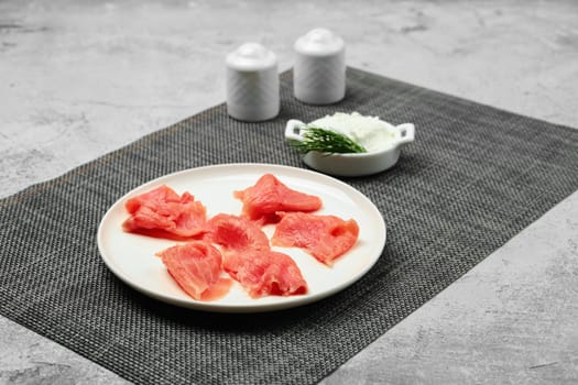 Thin slices of smoked trout on a plate