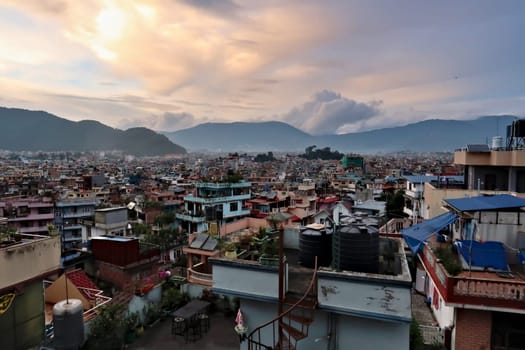 View over the colorful houses of Kathmandu from a rooftop on a cloudy evening, Kathmandu, Nepal 2022