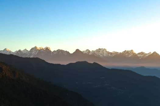 First glimpse of the Himalaya Mountain Range on the off-road ride from Kathmandu to Salleri, Phaplu, Bupsa, Jubing right before sunset, Nepal 2022