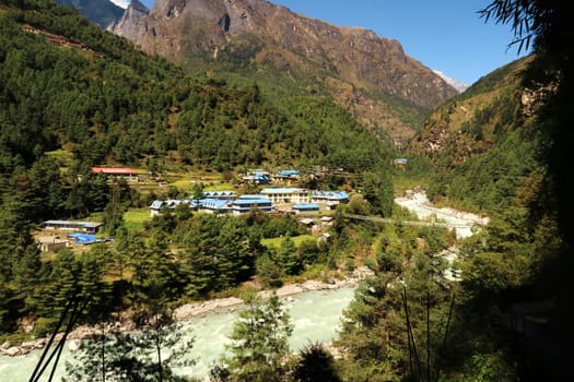 View onto the village of Phakding, right next to the Phakding suspension bridge over the Dudh Khosi River, Mount Everest Basecamp Trek, EBC, Nepal 2022