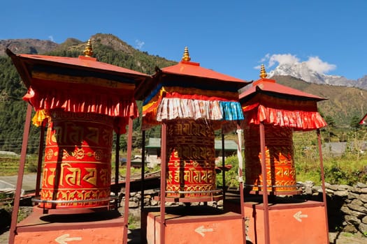 Big red prayer wheels between Lukla and Phakding, Mount Everest Basecamp Trek, Nepal 2022