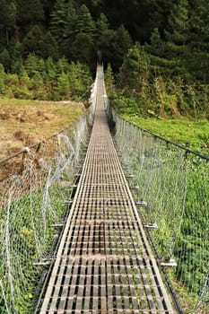 The Benkar-Manjo bridge, a long metal suspension bridge connecting the villages of Benkar and Monjo, Manjo, Mount Everest Basecamp Trek, EBC, Nepal 2022
