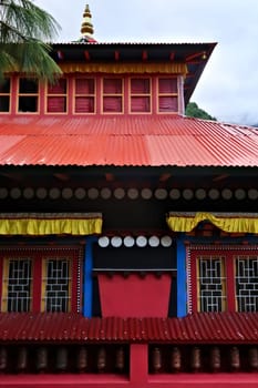 The colorful facade of the monastery built on a hill in the Monjo, Manjo village on the Mount Everest Basecamp Trek, EBC, Nepal 2022