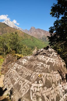 Big Mani stone close to the Chhuthawa, Ghat village, Chaurikharka on the Everest Basecamp Trek, Nepal 2022