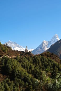 View onto the Tenzing Norgay Memorial Chhorten, Stupa near Namche Bazaar, Bazar, many people are gathering in the foreground, Lhotse and Ama Dablam can be seen in the background, Mount Everest Basecamp Trek, EBC, Nepal 2022