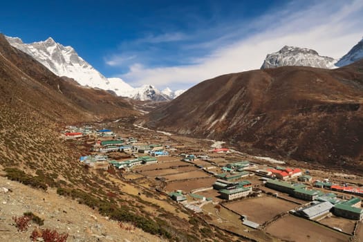 View onto Dingboche village, Mount Lhotse and Island peak can be seen in the background at the end of the valley, Mount Everest Base Camp Trek, EBC, Nepal 2022
