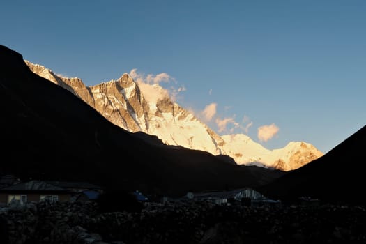 Dingboche around sunset, the village in the foreground is already dark when golden light is still shining on Mount Lhotse and the Island Peak in the background, Mount Everest Base Camp Trek, EBC, Nepal 2022
