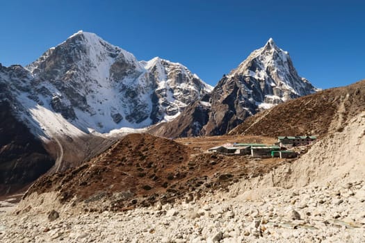 View onto the village of Dughla, Thukla in front of Mount Tobuche, Taboche and Cholatse, Mount Everest Base Camp Trek, EBC, Nepal 2022