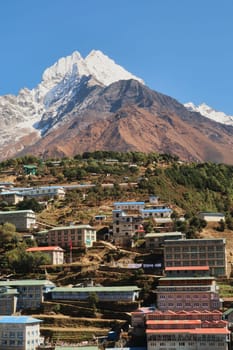 View onto a neighborhood of Namche Bazaar, Bazar with Mount Thamserku rising in the background, Mount Everest Base Camp Trek, EBC, Nepal 2022