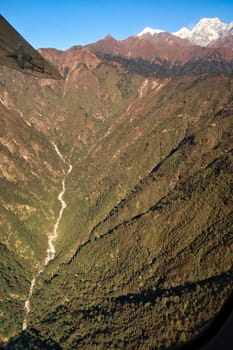 View out of the window on the flight from Lukla back to Kathmandu, spectacular mountain landscape, Mount Everest Base Camp Trek, EBC, Nepal 2022