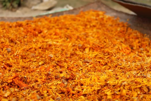 Freshly harvested and sliced, grated, ground, chopped Turmeric, Curcuma spread out on a woven mat for drying, Annapurna Circuit Trek, Nepal 2022