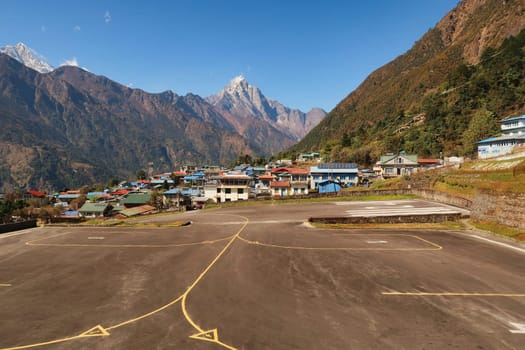 View onto the airfield, landing field of the Hillary-Tenzing Airport, Lukla Airport, Kongde Ri peak in the background, Mount Everest Base Camp Trek, EBC, Nepal 2022