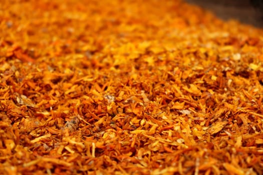 Freshly harvested and sliced, grated, ground, chopped Turmeric, Curcuma spread out for drying, Annapurna Circuit Trek, Nepal 2022