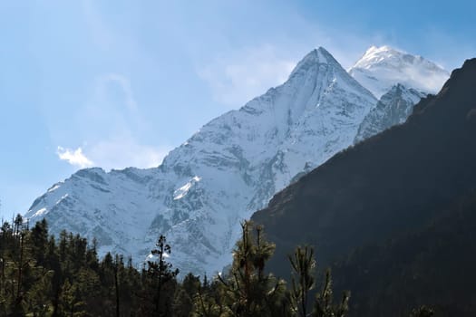 On the trail between Dhukur, Dhikur Pokhari and Upper Pisang looking back to two of the lower peaks of Mount Annapurna II, Annapurna Circuit Trek, Nepal 2022