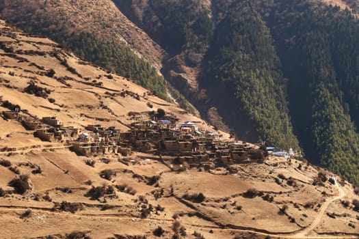 View onto the traditional mountain village of Ghyaru from the trail to Manang, Annapurna Circuit Trek, Nepal 2022