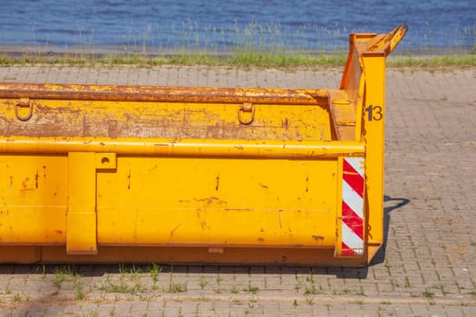 Orange skip with plant waste , Germany