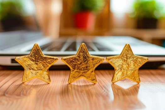Three golden stars of review in front of laptop computer on the desk. Golden stars of review or ranking. AI generated