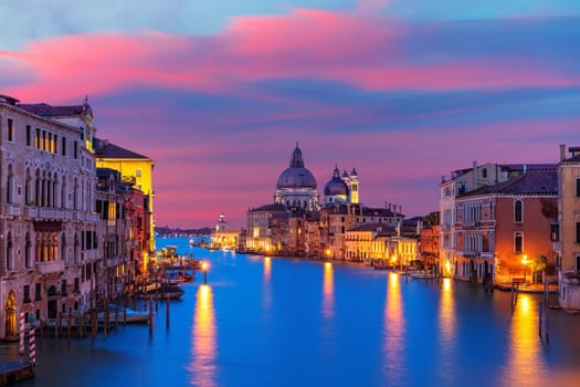 View of the Santa Maria della Salute dome in the Grand Canal at the evening, Venice, Italy.