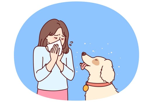 Little girl with dog suffers from allergies and uses handkerchief when communicating with beloved pet. Teenager child blows nose into paper napkin due to allergies or rhinitis caused by dog hair