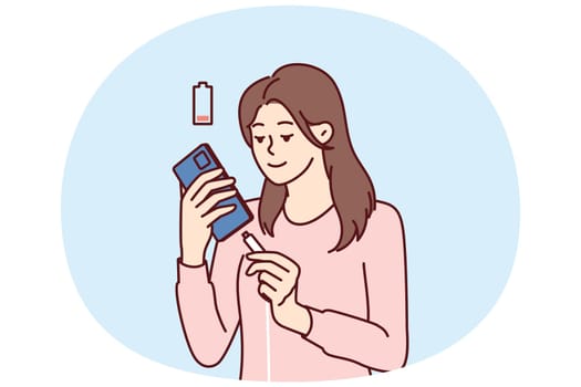 Woman holding smartphone uses cable to charge battery after seeing red indicator of dead accumulator. Girl with mobile phone connects type-c or usb mini wire for fast battery charging