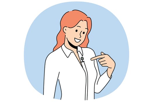 Woman with lavalier microphone on shirt smiles as she prepares for television interview. Girl with microphone for conducting business training and providing high-quality sound at corporate event