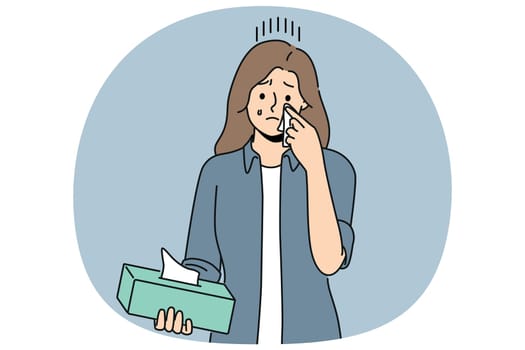 Crying woman wipes tears with paper napkins, experiencing stress and psychological suffering after breaking up with boyfriend. Crying girl holding box of disposable towels needing help of psychologist