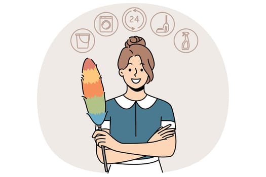 Woman housekeeper or maid with dust brush smiles and looks at screen recommending contacting cleaning company. Maid girl provides services for cleaning apartment or hotel rooms and washing clothes