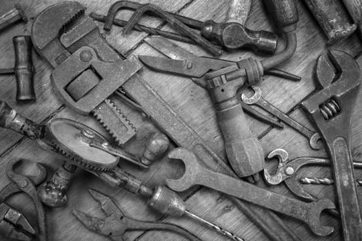 Vintage tools on a wooden background