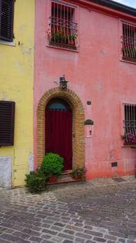 The wall at Borgo San Giuliano typical street with low and colorful houses at Rimini, Italy