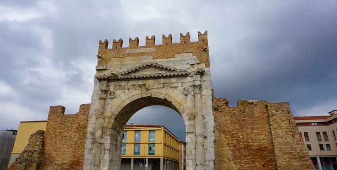 Rimini, Italy. Arch of Augustus, triumphal ancient architecture of Roman Empire, 27 BC at Italy
