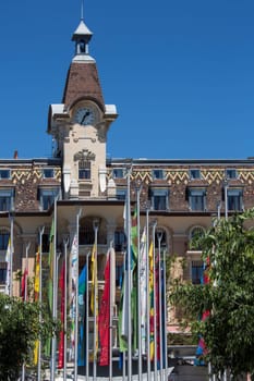 Flags and architecture in the town of Ouchy in the shore of Lake Geneva in Switzerland.
