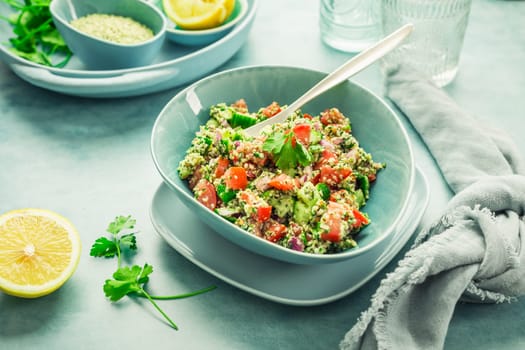Tabbouleh salad. Fresh homemade Tabouli salad with fresh parsley, onions, tomatoes and hempseeds.