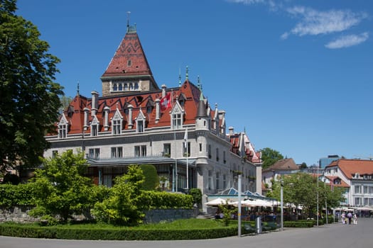 Chateau d'Ouchy and the waterfront in the town of Ouchy on the north shore of Lake Geneve in Switzerland.