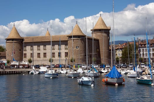 Medieval Morges Castle near the harbor in the town of Morges on the north shore of Lake Geneva in the Vaud canton in Switzerland. The castle dates from around 1340.