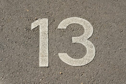 Marking on asphalt for parking lot number 13 in the city center of Leipzig in Germany