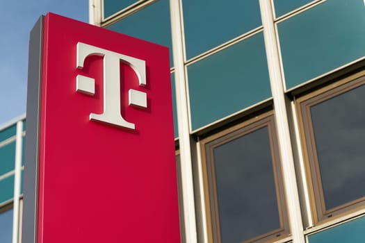 Logo of the Deutsche Telekom AG Group in front of a branch office in Magdeburg, Germany