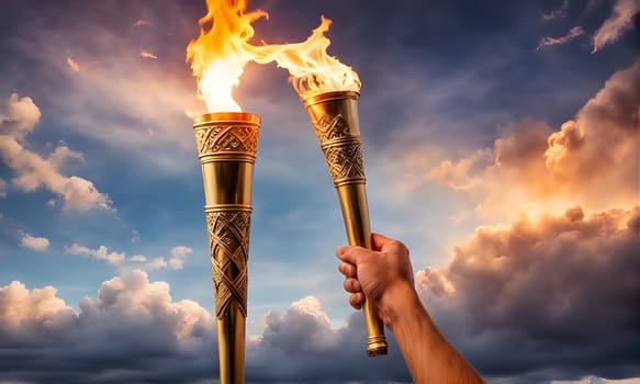 Two flaming torches held high by a hand against a dramatic sky, symbolizing unity, strength, and the spirit of competition and celebration.
