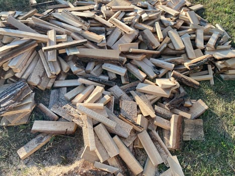 Chopping and sawing firewood from the slats