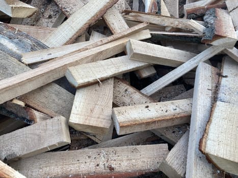Chopping and sawing firewood from the slats