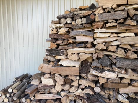 Chopping and sawing firewood from the slats