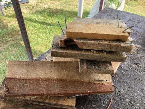 Chopping and sawing firewood from the slats