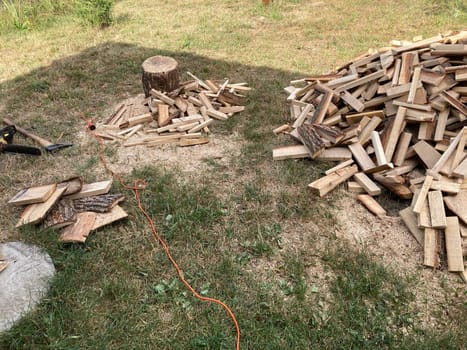 Chopping and sawing firewood from the slats