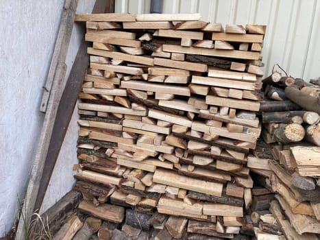 Chopping and sawing firewood from the slats