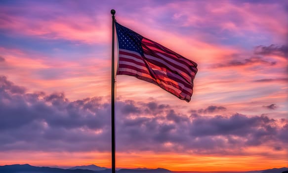 An American flag is flying proudly on a flagpole against a backdrop of a vibrant sunset. The sky is awash in hues of pink, purple, and orange, creating a dramatic and picturesque scene. The flag is waving gently in the breeze, its red, white, and blue stripes catching the light. In the distance, mountains are silhouetted against the horizon, adding depth and grandeur to the scene.