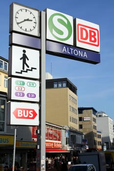 Signage outside Hamburg Altona railway station indicating railway, suburban railway and busses