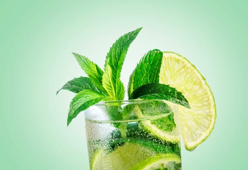 Closeup mojito cocktail with ice isolated over pastel background. Fresh mohito drink with lime and mint. Happy hour and beverage menu design.