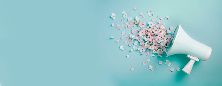 Megaphone with cherry blossoms, flowers spreading, advertising and marketing concept, social media, announce positive and creative idea