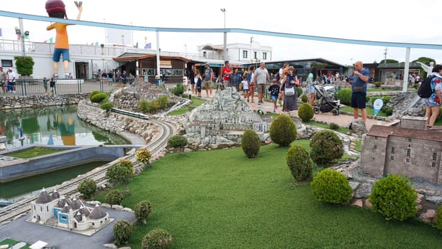 Viserba, Italy - June 25, 2024: People going at Theme park Italy in Miniature or Italia in Miniatura in Rimini, Italy - Reproduction of famous attractions in a small scale